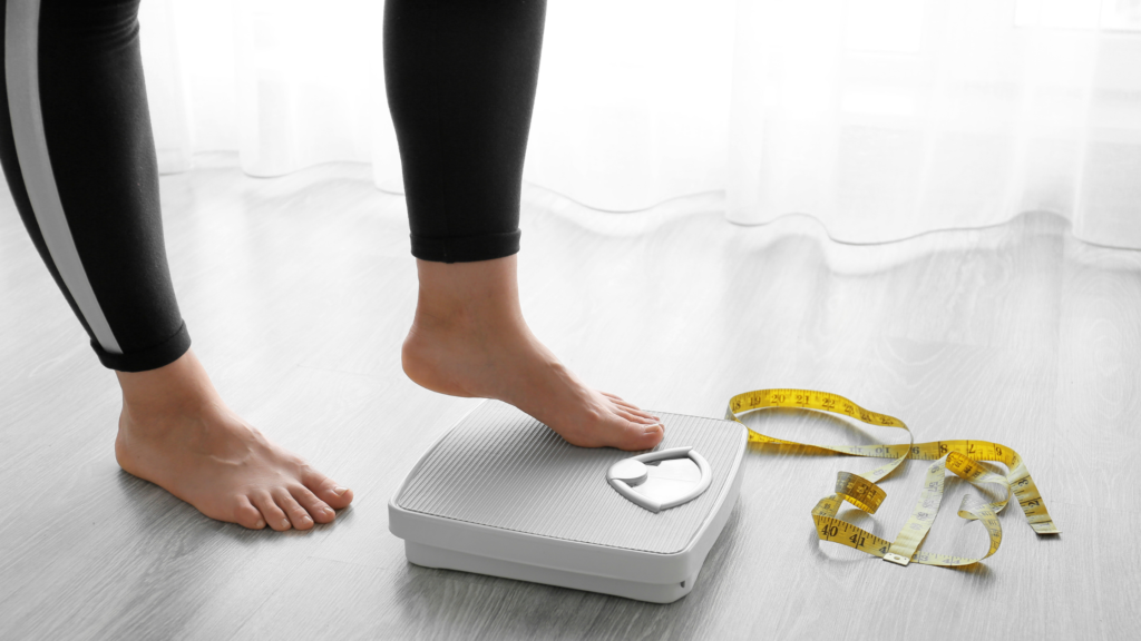 Rybelsus for weight loss: image of woman standing on weighing scale